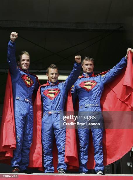 Red Bull Racing drivers Robert Doornbos of the Netherlands, Christian Klien of Austria and David Coulthard of Great Britain pose to promote the new...