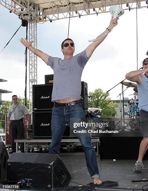 Stephan Jenkins of Third Eye Blind drinks from "beer bong" on stage at the 90th running of the Indianapolis 500 - Miller Lite Carb Day Concert Fe on...