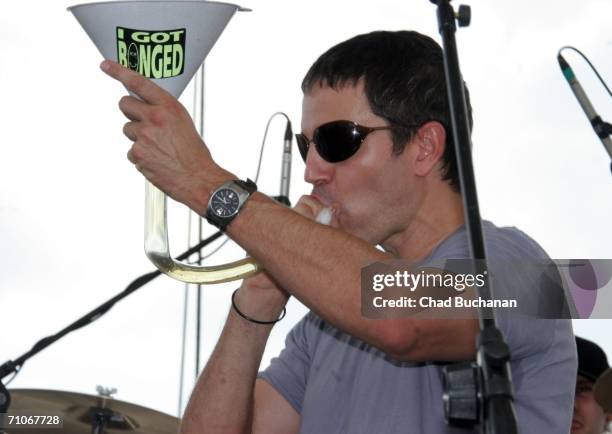 Stephan Jenkins of Third Eye Blind drinks from "beer bong" on stage at the 90th running of the Indianapolis 500 - Miller Lite Carb Day Concert Fe on...