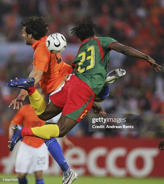 Ruud van Nistelrooy of Netherlands challenges for a header with Stephane Bikey of Cameroon during the international friendly match between...