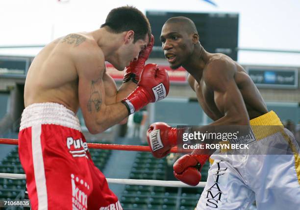 Carson, UNITED STATES: USA's Paul Williams pressures Argentina's Walter Dario Matthysse in their Welterweight NABO title bout at the Home Depot...