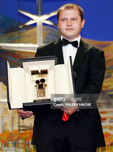 Romanian director Corneliu Porumboiu poses after winning the Camera d'Or for his film "12H08 a l'est de Bucarest" during the closing ceremony of the...