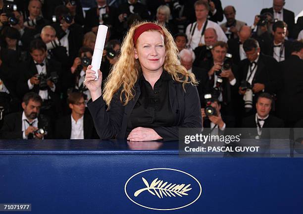 British director Andrea Arnold celebrates during a photocall after winning the Jury Prize for her first feature film "Red Road" during the closing...