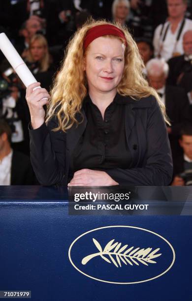 British director Andrea Arnold celebrates during a photocall after winning the Jury Prize for her first feature film "Red Road" during the closing...