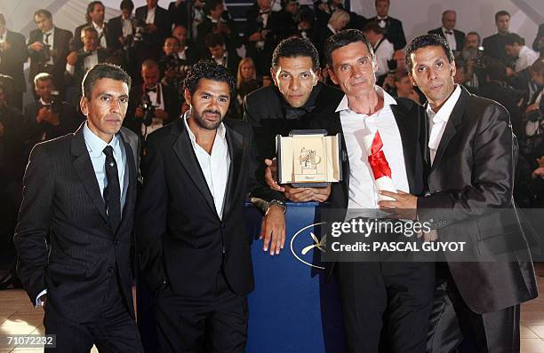 French actors Sami Bouajila, Bernard Blancan, Roschdy Zem, Jamel Debbouze pose with director Rachid Bouchareb during a photocall after winning the...