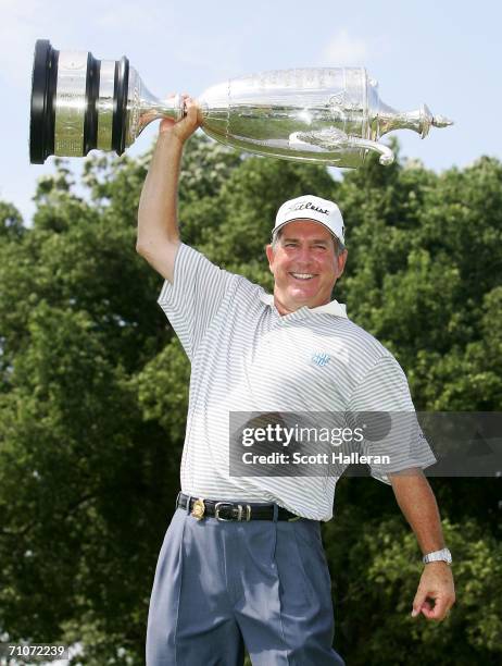 Jay Haas poses with the Bourne Trophy after defeating Brad Bryant on the third playoff-hole to win the 67th Senior PGA Championship on May 28, 2006...