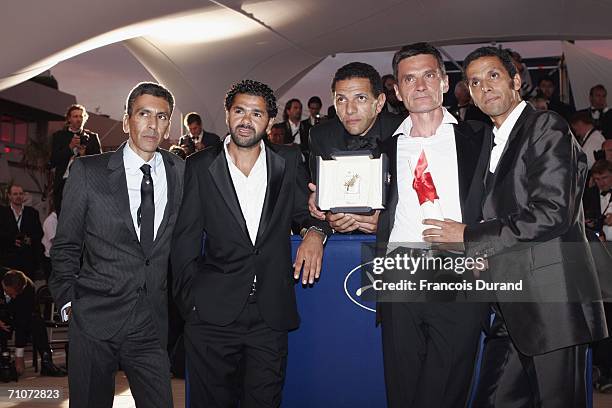 Director Rachid Bouchareb, actors Jamel Debbouze, Roschdy Zem, Bernard Blancan and Sami Bouajila attends the Palme d'Or Award Photocall during the...