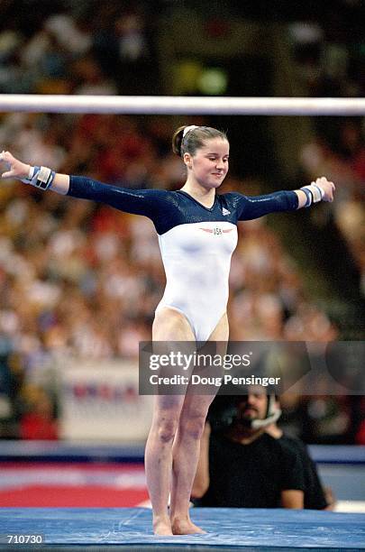 Elise Ray finished her routine in the Uneven Bars Event during the U.S. Women's Olympic Gymnastics Trials at the Fleet Center in Boston,...