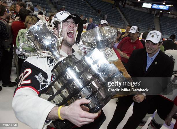 Alexander Radulov of the Quebec Remparts holds up both the Memorial Cup and the Stafford Smythe Memorial Trophy, awarded to the most valuable player...