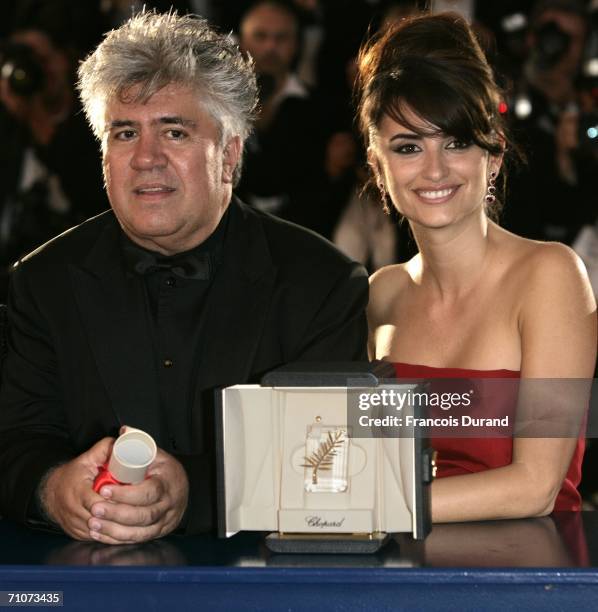 Spanish director Pedro Almodovar and actress Penelope Cruz pose with the Best Screenplay Award at the Palme d'Or Award Closing Ceremony during the...