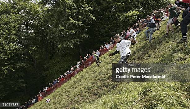 Competitors take part in a round of Cheese Rolling on Coopers Hill on May 29, 2006 in Gloucester, England. The annual tradition which is thought to...