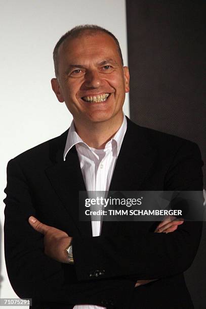 Herzogenaurach, GERMANY: Erich Stamminger, president and CEO of the Adidas brand, smiles after the unveiling of a statue of Adolf Dassler, founder of...