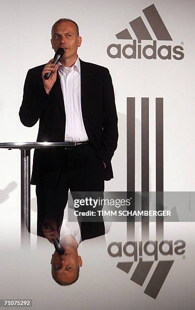 Herzogenaurach, GERMANY: Erich Stamminger, president and CEO of the Adidas brand, gives a press conference for the unveiling of a statue of Adolf...