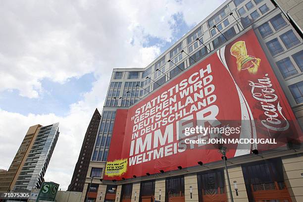 Giant billboard reading "Statistically, Germany always wins the Football World Cup on home turf" in reference to then West Germany's victory in the...