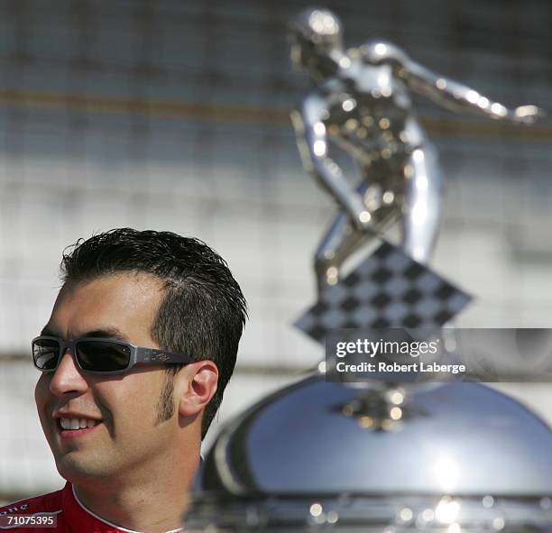 Sam Hornish Jr., driver of the Marlboro Team Penske Dallara Honda, poses with the Borg-Warner Trophy during the official trophy presentation for the...