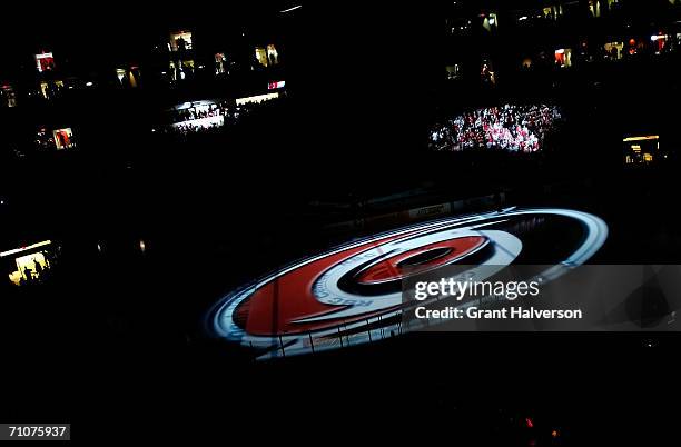 An image of the Carolina Hurricanes logo is projected on the ice during the pre-game festivities at the RBC Arena prior to the start of game five of...