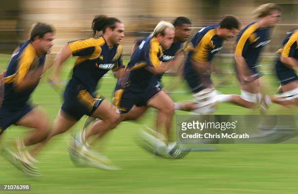 George Smith runs through sprint drills during the Australian Wallabies training session held at Victoria Army Barracks May 30, 2006 in Sydney,...