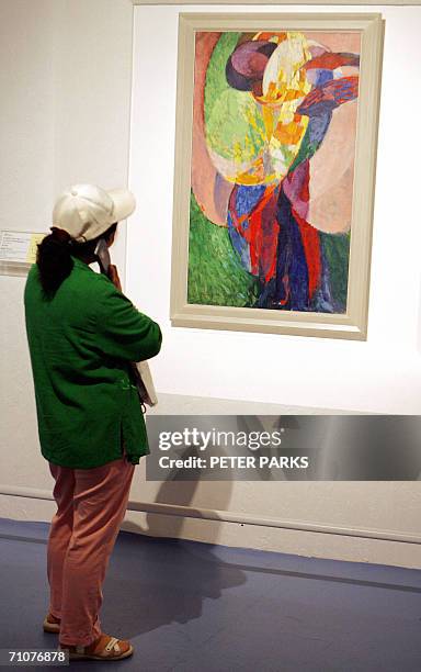 Visitor looks at the painting "Amorpha" by Czech artist Frantizek Kupka at Beijing's World Art Museum, 30 May 2006. The show features 60 late 19th...