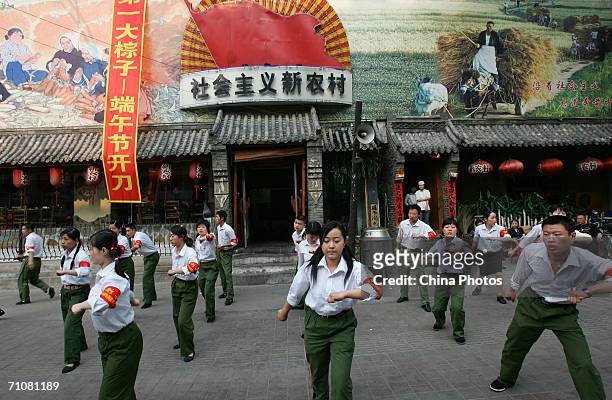 Attendants dressed as Red Guards dance the Zhongziwu at a Chinese Cultural Revolution-themed restaurant May 30, 2006 in Changchun, Jilin Province,...