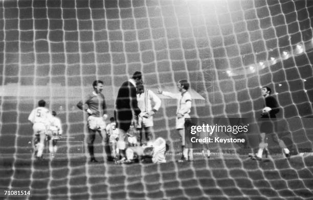 An Estudiantes de la Plata player lays in the goalmouth in an incident at Old Trafford during the World Club Championship final between the...