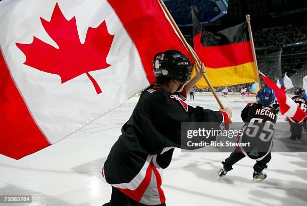 Kids skate around with National flags during the pre-game festivites before the start of game six of the Eastern Conference Finals between the...