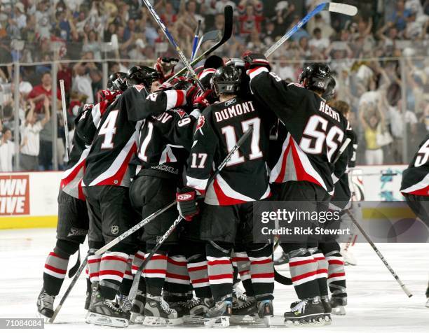 The Buffalo Sabres celebrate winning game six after a goal by Daniel Briere in overtime over the Carolina Hurricanes during the Eastern Conference...