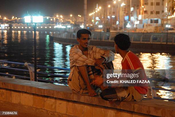 Yemeni youths sit by the Mukalla Khoor in the southern port city of Mukalla, 850 kms east of Sanaa, late 30 May 2006. Saudi Crown Prince Sultan bin...