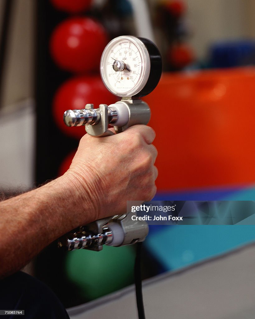 Human hand holding dynamometer