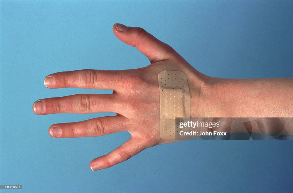 Hand Plus Paster Hand With Plaster High-Res Stock Photo - Getty Images