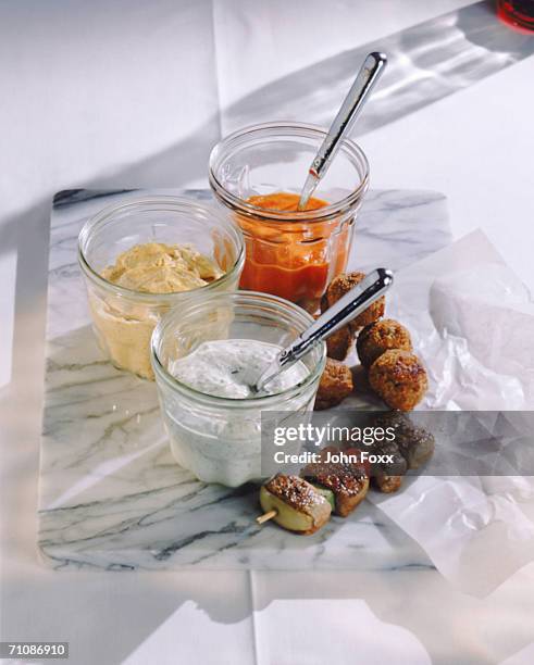 kebab and meatball with hummus on marble, close-up - tzatziki stock-fotos und bilder