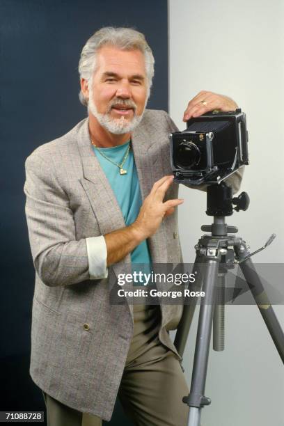 Country music singer, actor and photographer, Kenny Rogers, poses during a 1986 Los Angeles, California, studio portrait session. Rogers was...