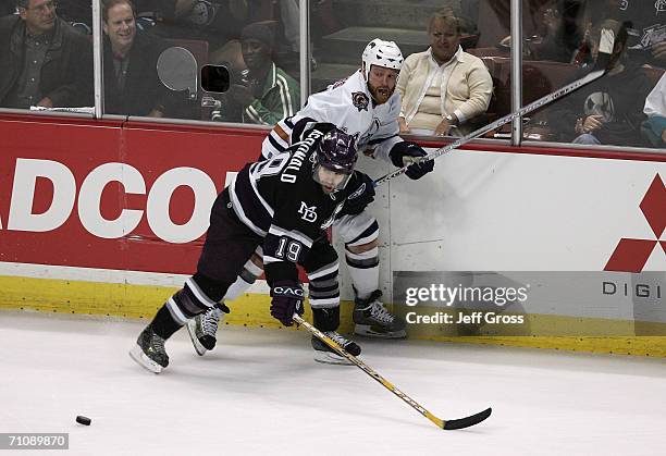 Andy McDonald of the Mighty Ducks of Anaheim checks Raffi Torres of the Edmonton Oilers during game five of the NHL Western Conference Finals on May...