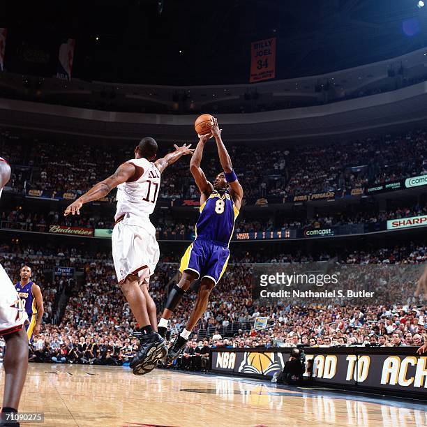 Kobe Bryant of the Los Angeles Lakers shoots a fade-away jump shot over Doug Overton of the Philadelphia 76ers during game three of the 2001 NBA...