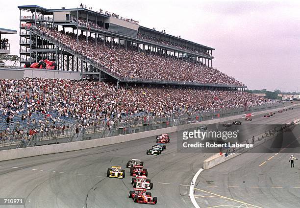 View of the cars as they round the corner at the start of the Target Grand Prix of Chicago, Presented by Energizer, part of the 2000 CART FedEx...