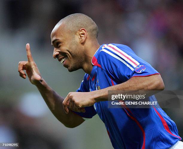 French forward Thierry Henry celebrates after scoring the first goal during the friendly football match France vs Denmark at the Bollaert stadium in...