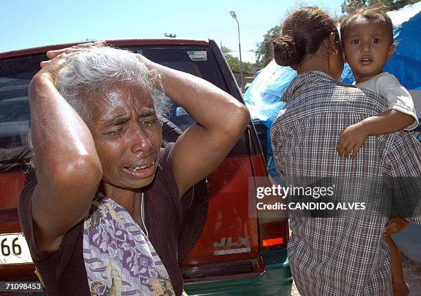 Woman cries after she lost her son who died during gang fights between west and east timorese groups in Dili 01 June 2006, the capital which has...