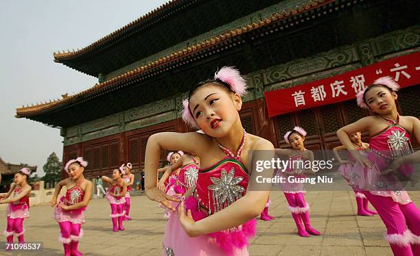 Chinese children prepare a performance to mark the International Children's Day on June 1, 2006 in Beijing, China. Students take a day off and...