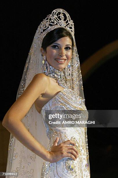 Miss Egypt 2006 Fawzaya Mohammed models a gown by Egyptian haute couture designer Hani El-Behairi, during his signature show in Cairo, late 31 May...