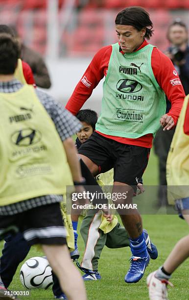 Jablonec nad Nisou, CZECH REPUBLIC: Czech international , Aston Villa striker, Milan Baros plays a football with kids from a various orphaneges 01...