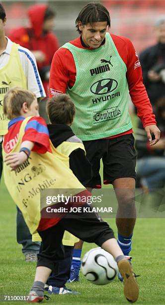 Jablonec nad Nisou, CZECH REPUBLIC: Czech international , Aston Villa striker, Milan Baros plays football with kids from a various orphaneges 01 June...