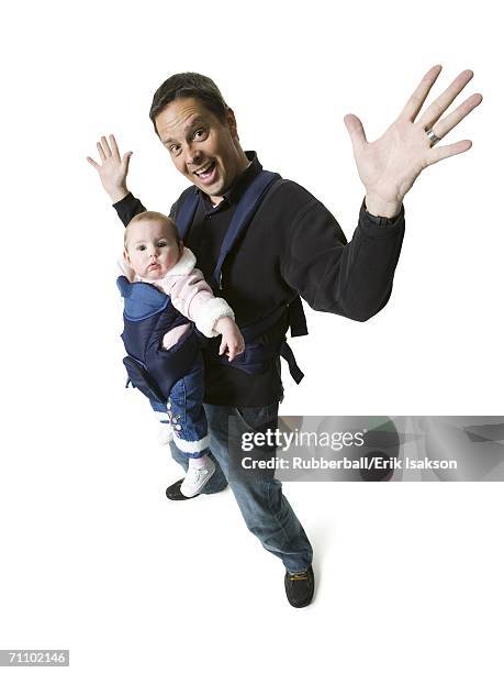 high angle view of a mature man carrying his daughter - huisman stockfoto's en -beelden