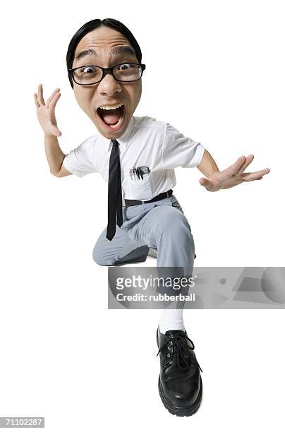 portrait of a young man making a face - kung fu pose stock pictures, royalty-free photos & images