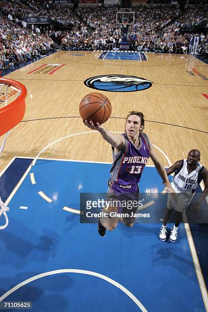 Steve Nash of the Phoenix Suns drives to the basket for a layup in game one of the Western Conference Finals against the Dallas Mavericks during the...