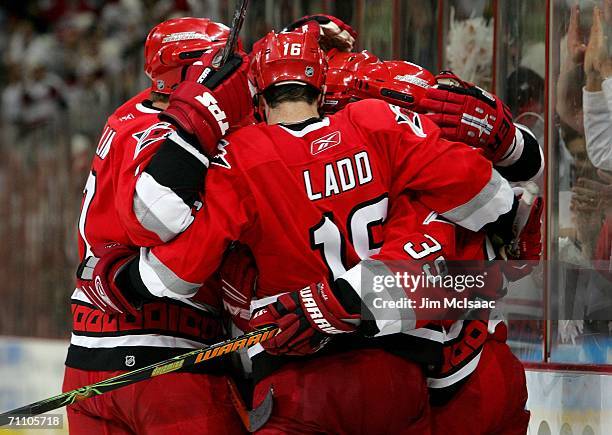 The Carolina Hurricanes celebrate a goal by Doug Weight during the third period against the Buffalo Sabres in game seven of the Eastern Conference...