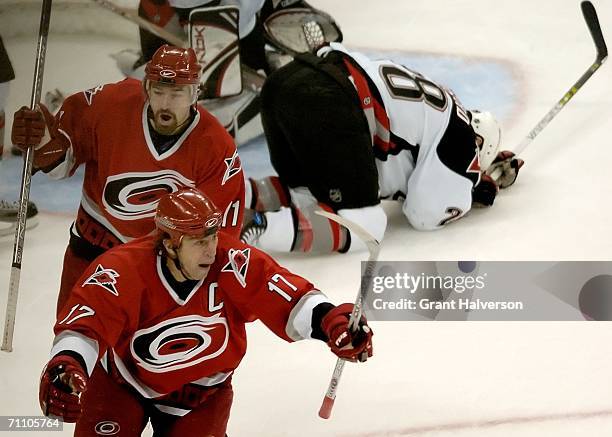 Rod Brind'Amour of the Carolina Hurricanes celebrates his game-winning goal in front of teammate Justin Williams during the third period against the...