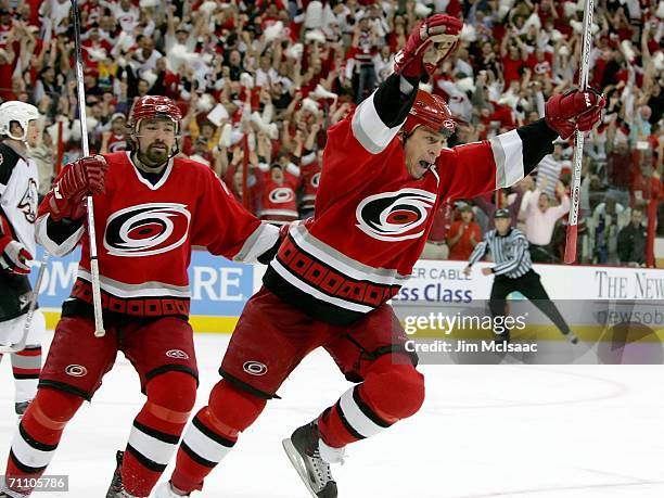 Rod Brind'Amour of the Carolina Hurricanes celebrates his game-winning goal in front of teammate Justin Williams during the third period against the...