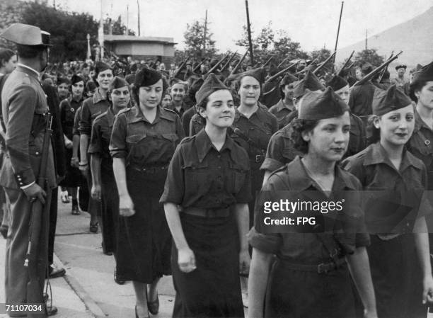 Falangist woman march through Irun in northern Spain, to celebrate the city's liberation from Republican rule during the Spanish Civil War, 5th...
