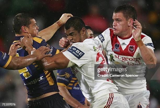 Timana Tahu of the Eels and Charlie Leaeno of the Dragons have a scuffle during the round 13 NRL match between the St George Illawarra Dragons and...