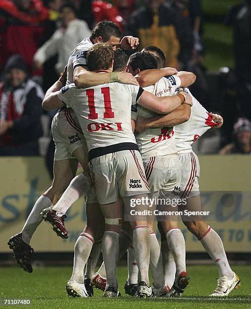 Dragons players celebrate a try on full time during the round 13 NRL match between the St George Illawarra Dragons and the Parramatta Eels at OKI...