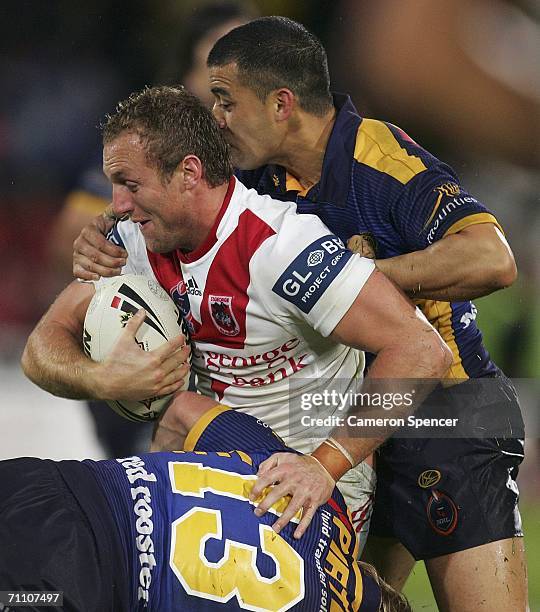 Mark Gasnier of the Dragons is tackled during the round 13 NRL match between the St George Illawarra Dragons and the Parramatta Eels at OKI Jubilee...